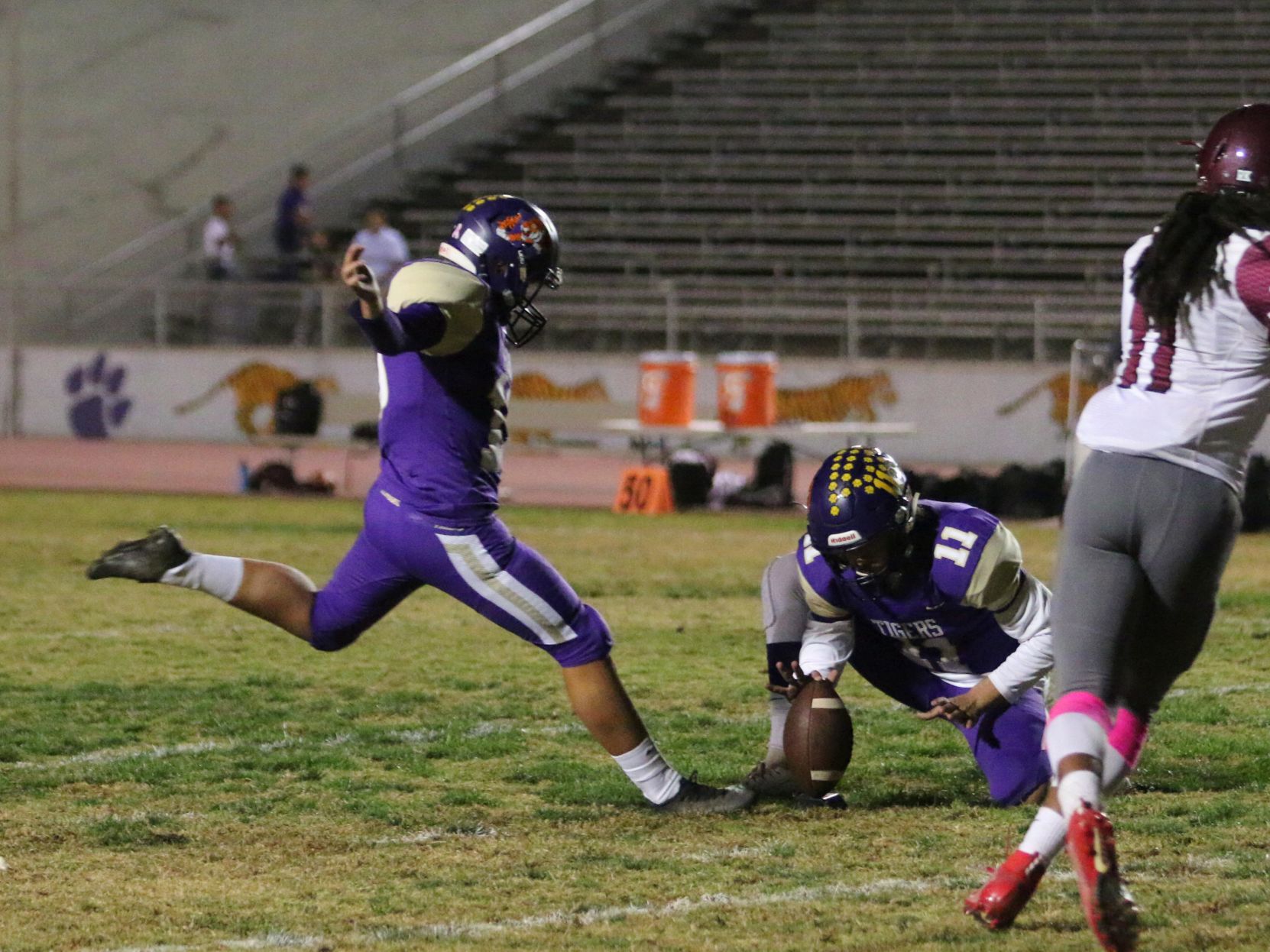 Tigers stay hot with 42-6 rout of Pioneers, clinch playoff spot
